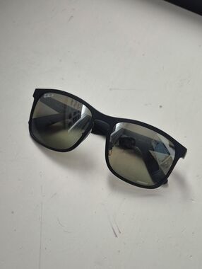 Ray-Ban Matte Black Frame Sunglasses with Green-Tinted Lenses